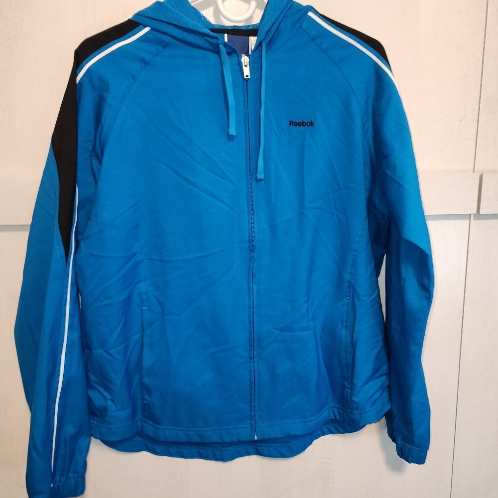 Preowned Reebok, medium blue and black‎ windbreaker